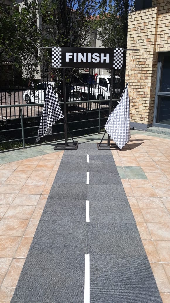 Carpet tiles with white tape imitating a road